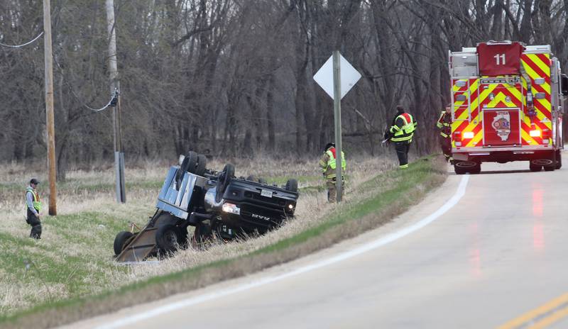 Utica firefighters work the scene of a single vehicle rollover just to the west of the entrance of the Starved Rock Lock and Dam Visitors Center on Dee Bennett Road on Monday, April 7, 2025 near Utica. La Salle County Sheriff, Utica Police, Fire and EMS all responded to the scene. The crash happened shortly before 1p.m. The driver was uninjured.