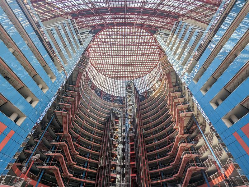 The interior of the James R. Thompson Center, with exposed stairs, structural supports and its prominent elevator shaft, is visible from the ground floor of the 17-story atrium.