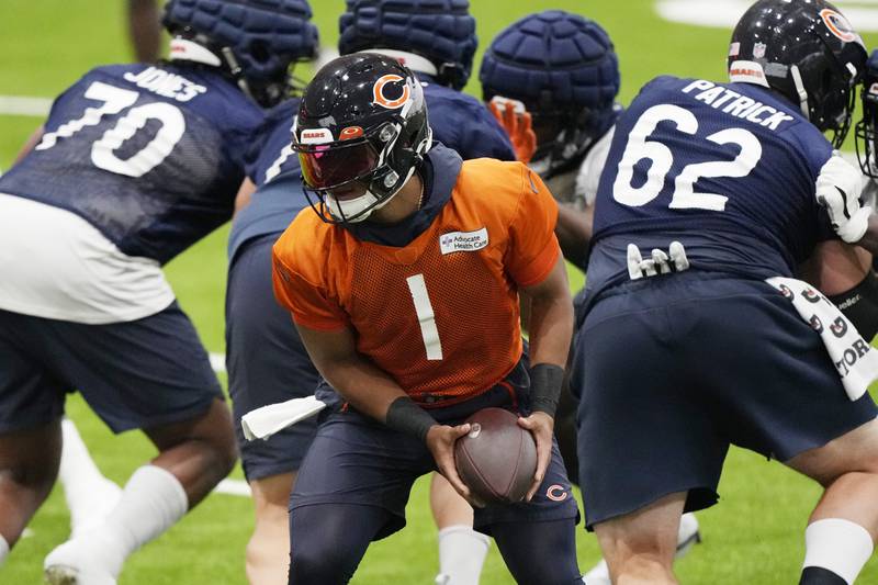 Chicago Bears quarterback Justin Fields works with teammates during practice, Tuesday, June 13, 2023, in Lake Forest.