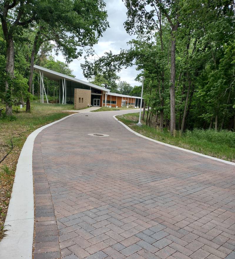 A brick path leads from the parking lot to the Wellness Center at Nell's Woodland in Ottawa. The grounds are open to the public Sundays and Mondays from 7 a.m. to 7 p.m. Online registration is recommended before arrival to ensure available parking.