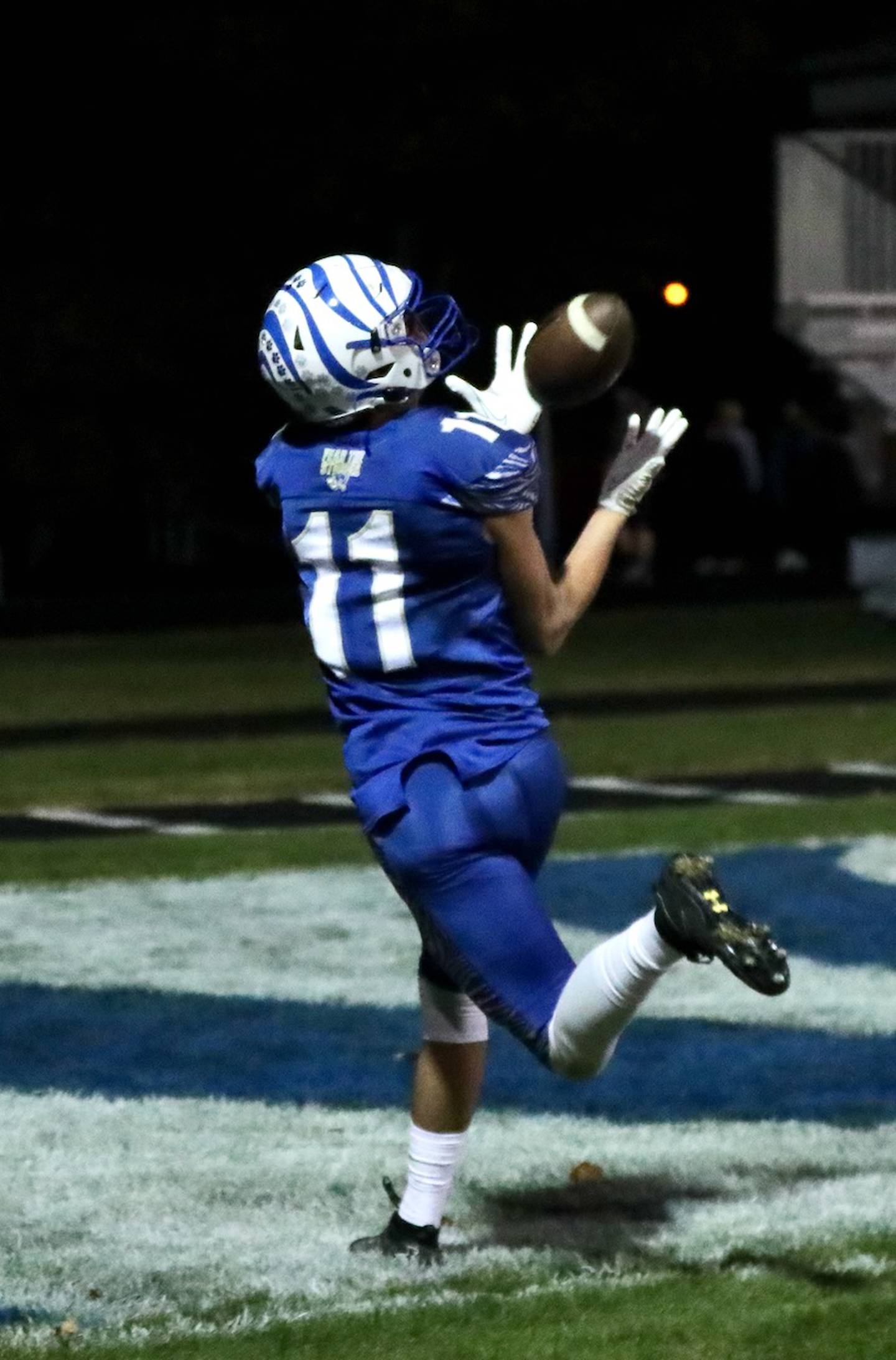 Princeton's Noah LaPorte grabs a touchdown pass Friday night at Bryant Field. The Tigers beat Peotone 56-28.