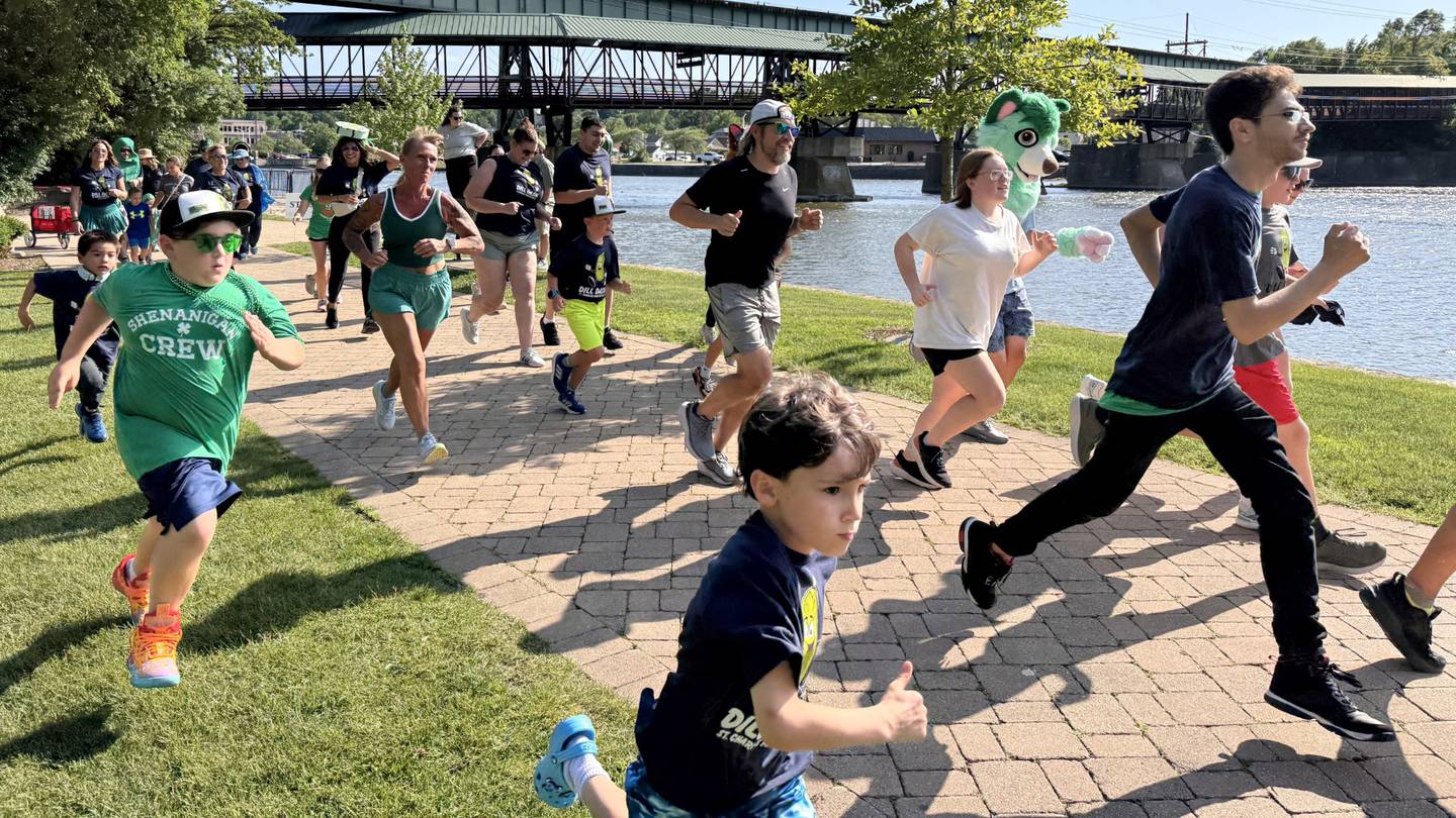 Runners take off from the starting line Dill Dash race at the second annual Pickle Paradise festival at Pottawatomie Park in St. Charles on June 20, 2025.