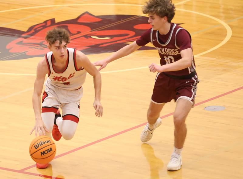 Hall's Jacob Andracke sprints down the court against Rockridge's Rylan Daly during the Class 2A Regional quarterfinal game on Monday, Feb. 23, 2026 at Hall High School.