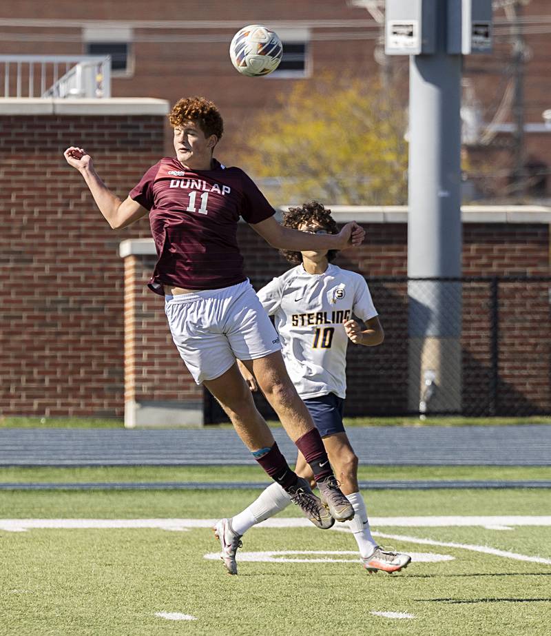 Dunlap’s Anaas Rahmoun leaps for a ball against Sterling Saturday, Oct. 21, 2023 in the regional finals game in Sterling.