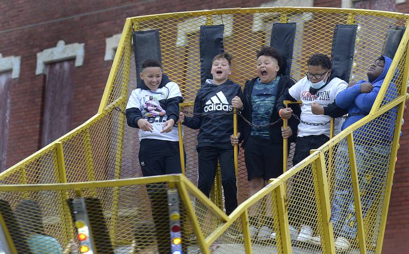 These riders let go with a scream as they get airborne Friday, May 27, 2022, while riding The Scat during Park Fest in Streator.