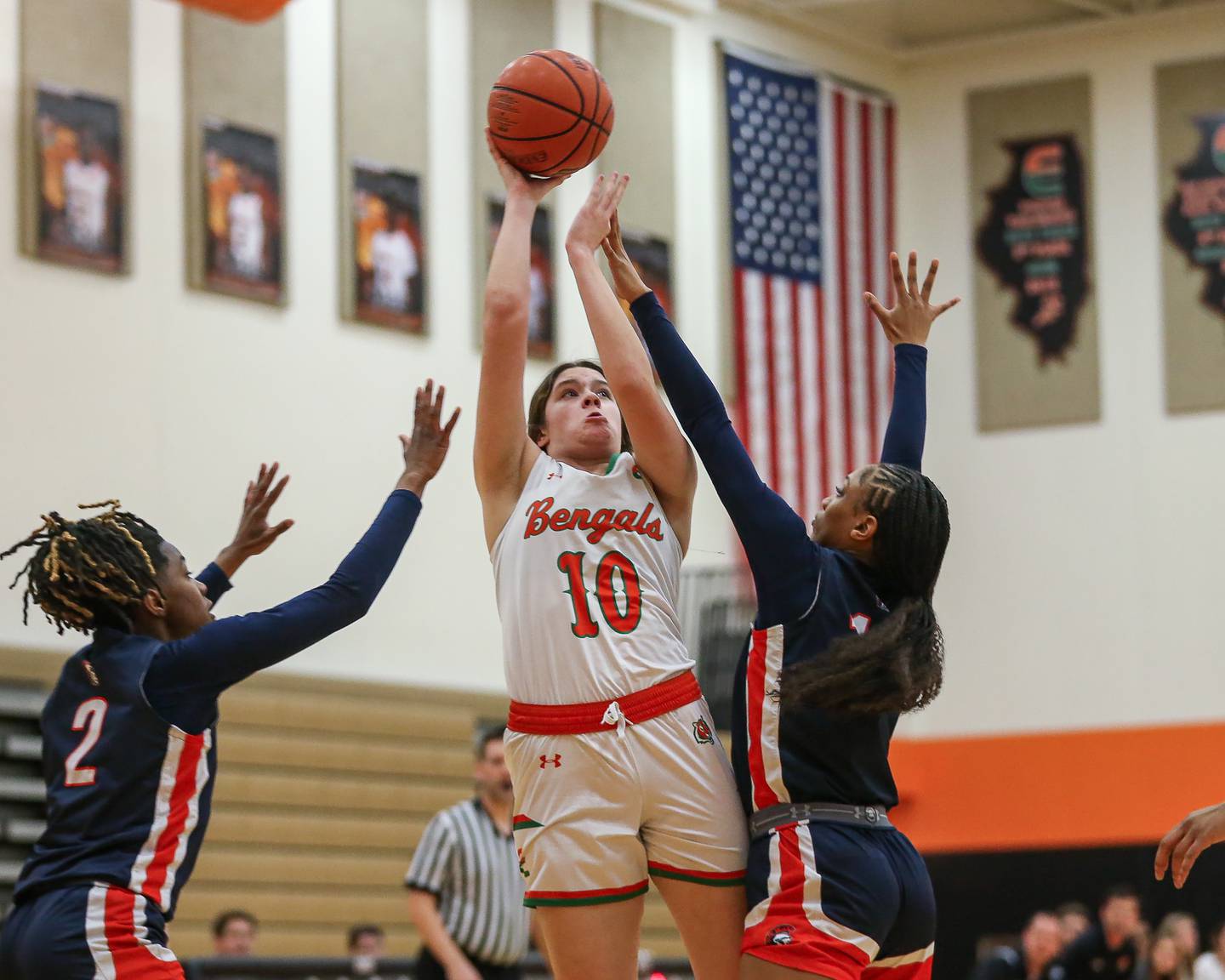 Plainfield East's Emma Rodgers (10) shoots a contested shot during basketball game between Romeoville at Plainfield East. Feb 8, 2024.