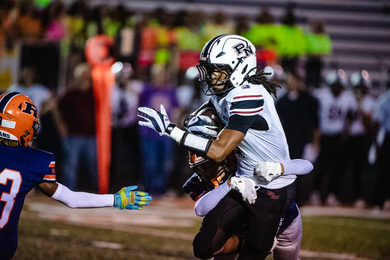 Plainfiled North's Mariell Macon is brought down by Romeoville's Jayden Melendez during a game on Friday Sept. 19, 2025 at Romeoville High School