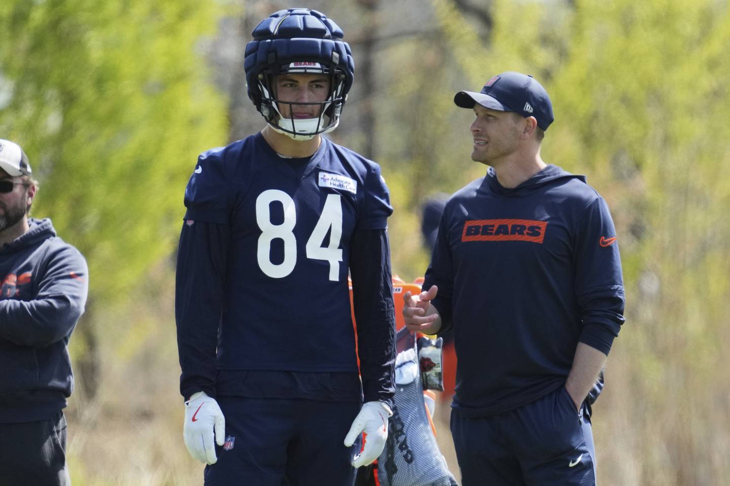 Chicago Bears head coach Ben Johnson, right, talks with Colston Loveland during the NFL football team's rookie camp in Lake Forest, Ill., Saturday, May 10, 2025. (AP Photo/Nam Y. Huh)