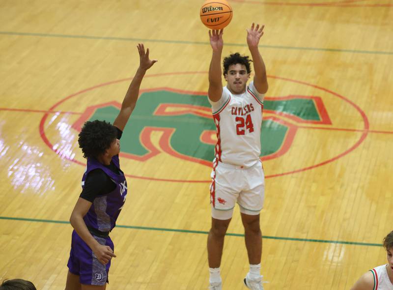 L-P's Marion Persich shoots a jump shot over Dixon's Xavion Jones during the Class 3A Regional semifinal game on Wednesday, Feb. 25, 2026 in Sellett Gymnasium at L-P High School.