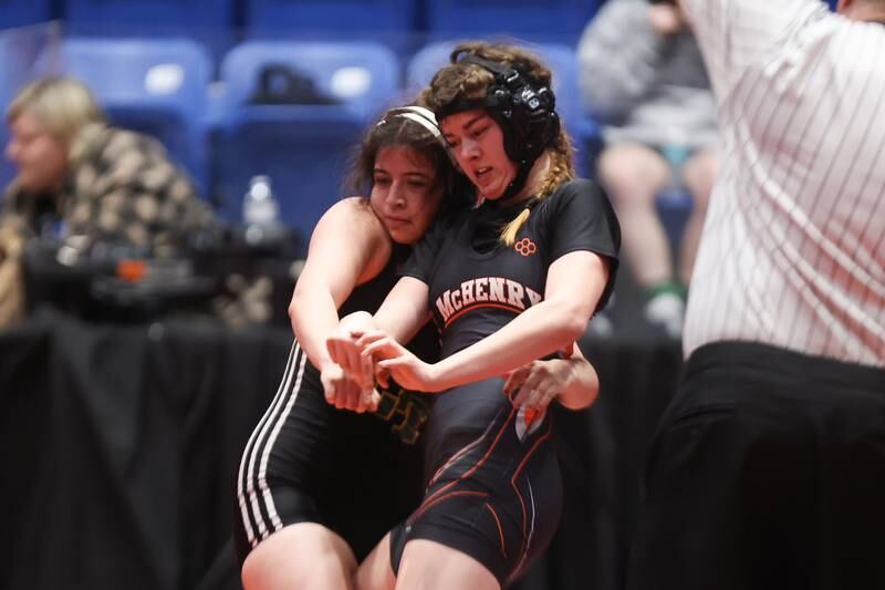 McHenry’s Emma Garrett escapes the grip of Lane’s Neomie Marchan in the 140 pound 5th place match at Grossinger Motor Arena in Bloomington. Saturday, Feb. 26, 2022, in Champaign.