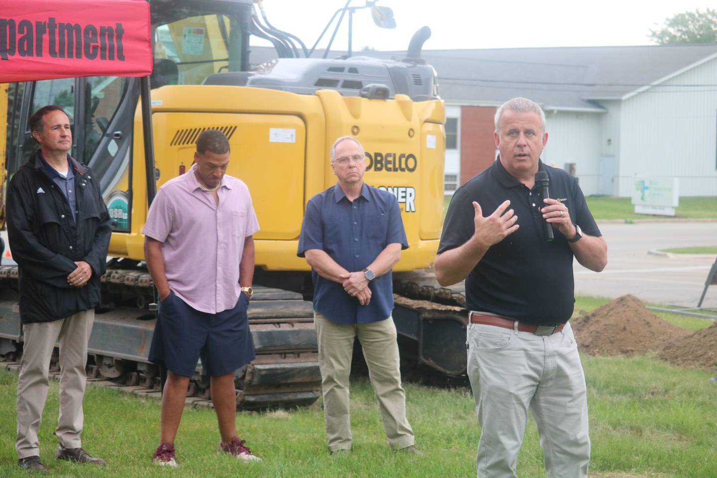Mayor Cohen Barnes (right) gives remarks during a May 24, 2024 groundbreaking for the fourth fire station planned at 1130 S. Malta Road, DeKalb.