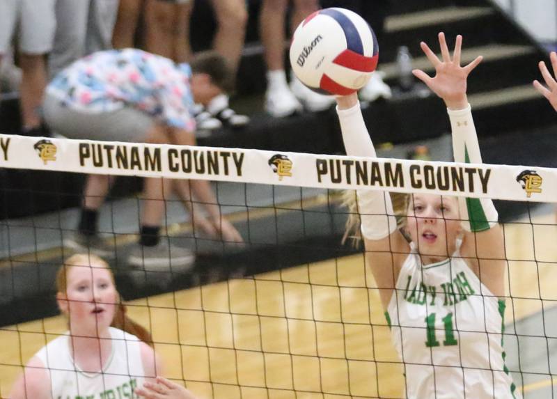 Seneca's Franki Meyers blocks a spike from Henry-Senachwine during the Tri-County Conference championship game on Thursday, Oct. 16, 2025 at Putnam County High School.