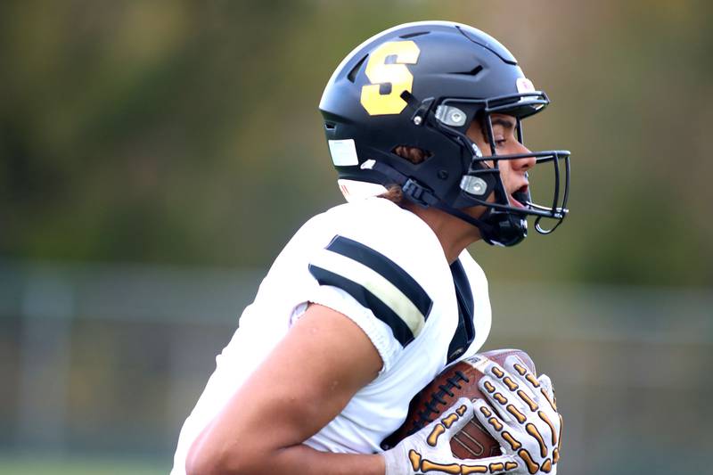 Sycamore’s Josiah Mitchell runs the ball in IHSA football Class 5A first-round playoff action at Al Bohrer Field on the campus of Cary-Grove High School in Cary on Saturday, November 1, 2025.