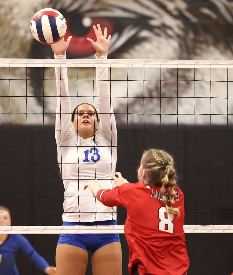 Hinckley-Big Rock's Raven Wagner tries to block the ball hit by Indian Creek's Bella Klotz during their match Tuesday, Sept. 19, 2023, at Indian Creek High School in Shabbona.