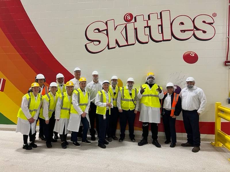 Super Bowl Champion Marshawn Lynch poses with Gavin Kueber, the site director of the Mars Wrigley Yorkville factory, and the team responsible for making the facility’s Skittles. Lynch was filming an episode of his Thursday Night Football show ‘N Yo’ City that aired on Dec. 26, 2024.