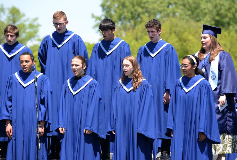 Downers Grove South Madrigal Singers perform during the graduation ceremony Sunday May 21, 2023.
