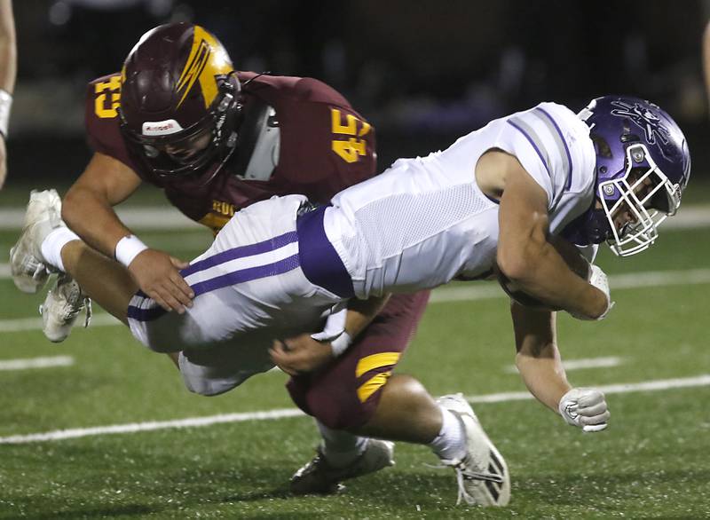 Richmond-Burton's Braxtin Nellessen tackles Rochelle's Grant Gensler during a Kishwaukee River Conference football game on Friday, Oct.20, 2023, at Richmond-Burton High School.