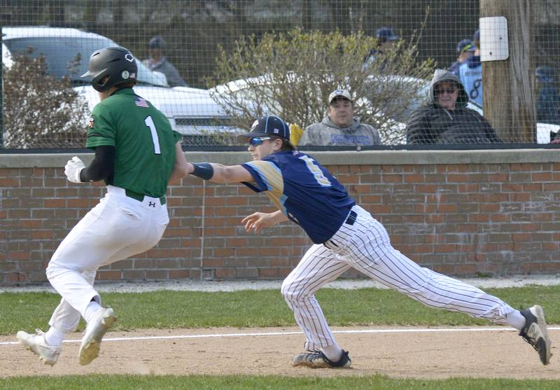 Dwight’s Drew Anderson escapes the tag from Marquette’s Caden Durdan on a play at 3rd base Thursday at Masinelli Field in Ottawa.