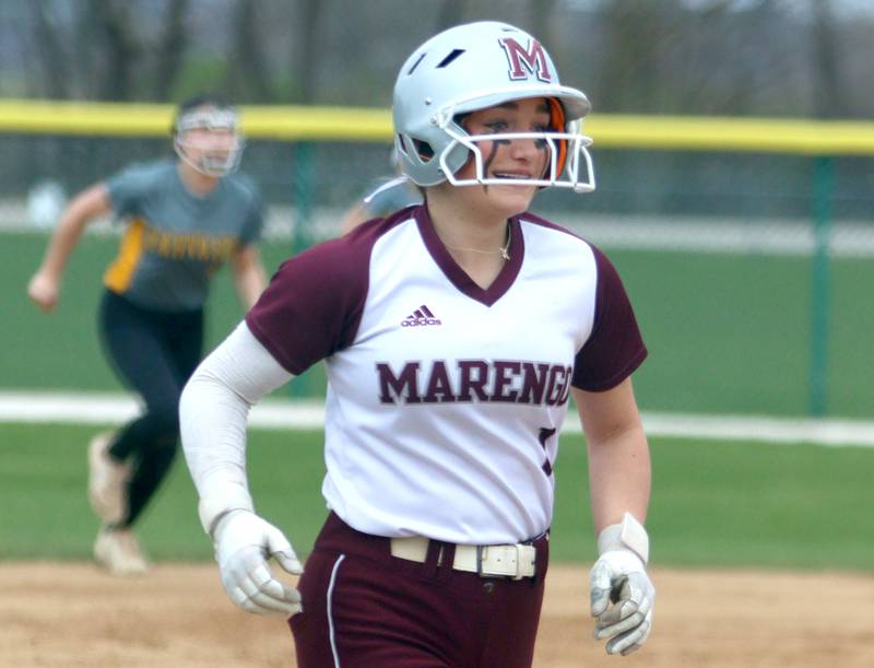 Marengo’s Gabby Christopher cruises home on a home run against Harvard in varsity softball at Marengo Thursday.