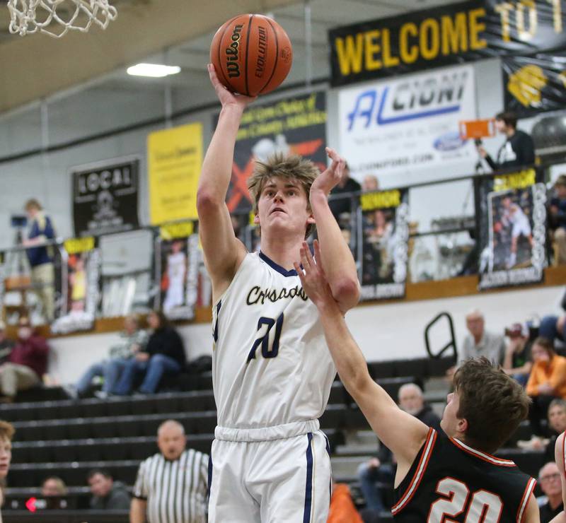 Marquette's Logan Nelson shoots a jump shot in the lane over Roanoke-Benson's Jackson Beer during the Tri-County Conference Tournament on Wednesday, Jan. 25, 2023 at Putnam County High School.