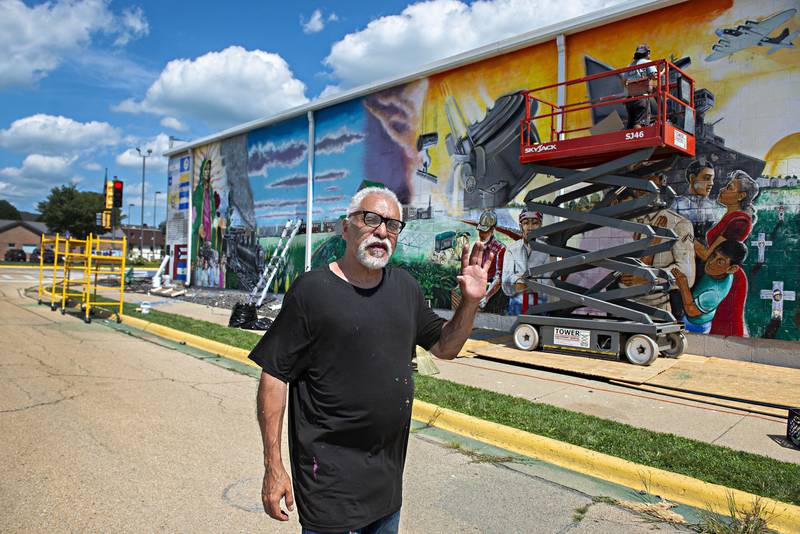 Robert Valdez of Chicago talks about the decisions and guidance offered to him back in 1999 when he created and painted the mural “Adelante” in Sterling. Valdez is back to restore the work in time for this year’s fiesta celebration.