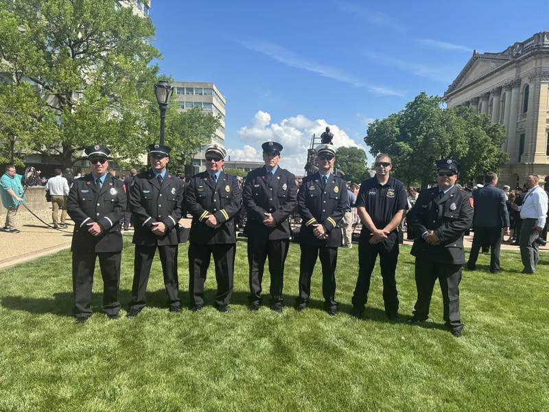 Streator firefighters pose for a photo on the Capitol lawn in Springfield following the 32nd Annual Illinois Fallen Firefighter Memorial and Firefighting Medal of Honor Ceremony on Wednesday, where they were honored for their life-saving actions during a Jan. 1, 2024 house fire.