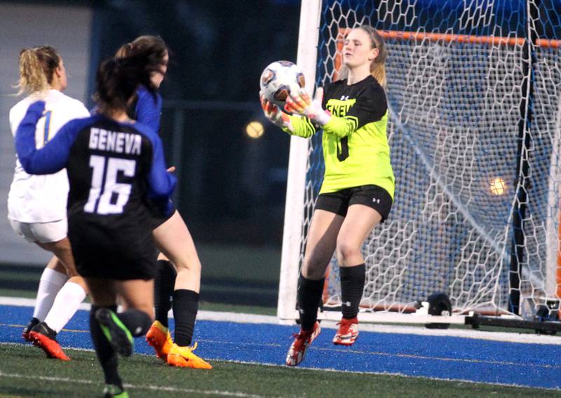 Geneva goal keeper Jordan Forbes makes a save during a home game against Lyons Township on Thursday, March 24, 2022.