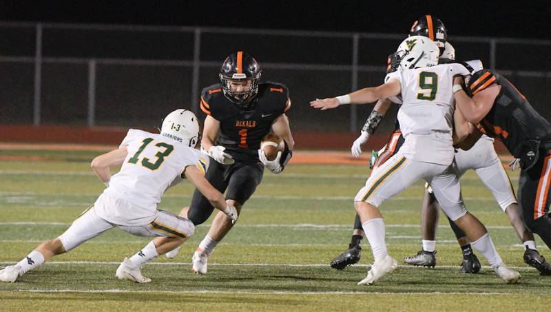 DeKalb's Talen Tate (1) runs up the middle against Waubonsie in DeKalb on Friday, Oct. 1, 2021.