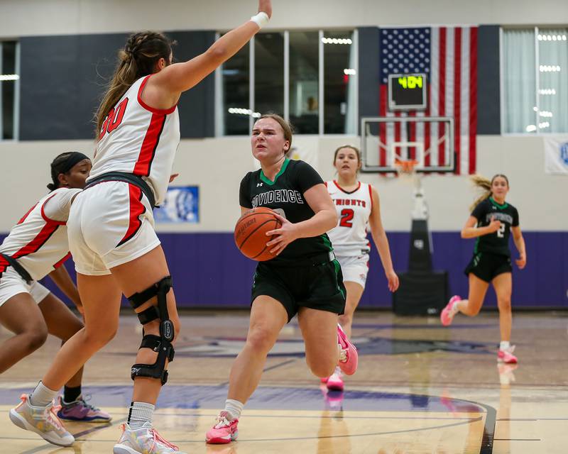 Providence's Gabi Bednar (20) drives to the basket in the WJOL Tournament Championship game. Nov 18, 2023.