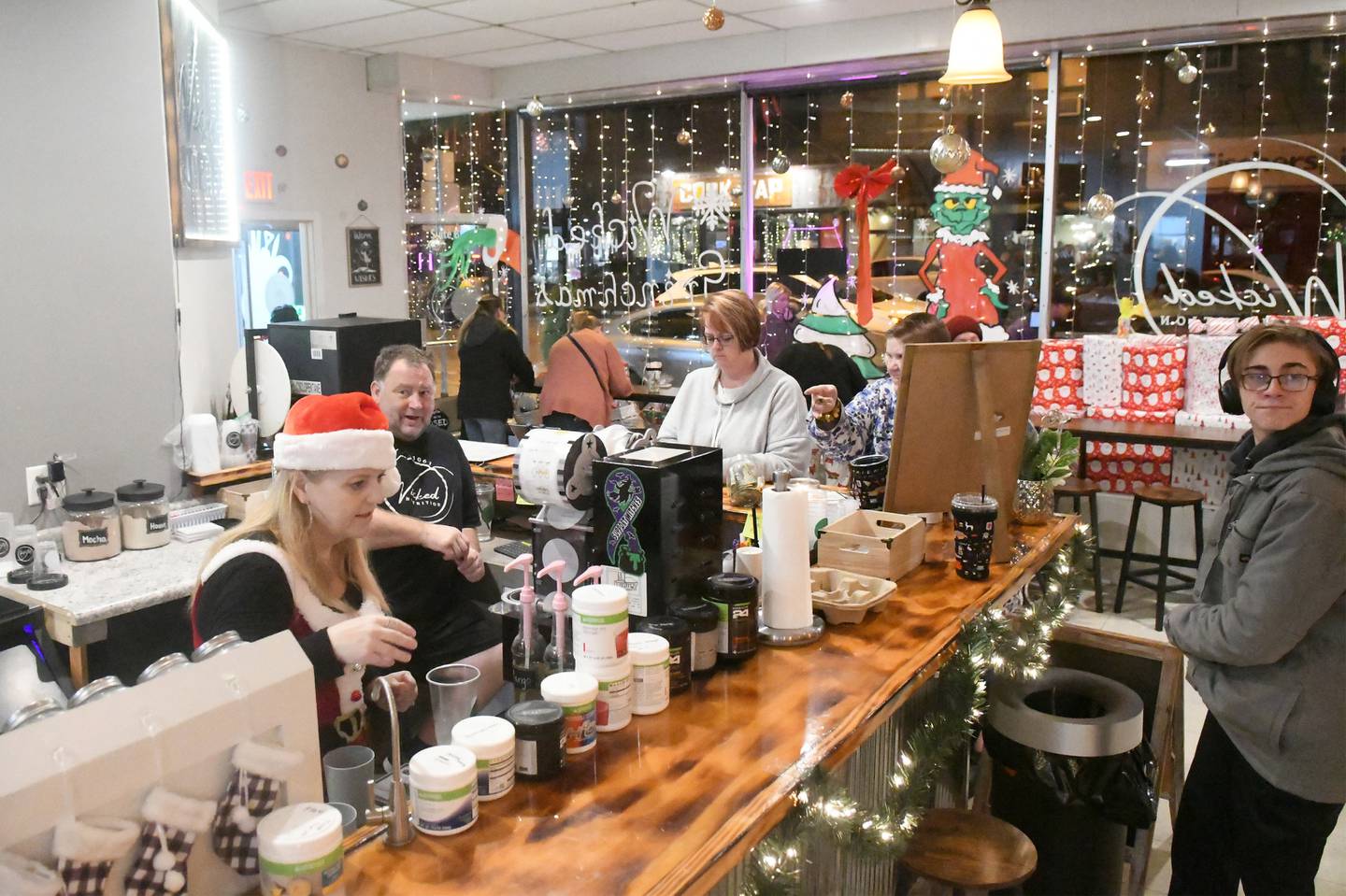 Staff at Wicked Nutrition in downtown Oregon were busy during Oregon's Candlelight Walk on Nov. 26. The store was one of the stores taking part in the evening event.