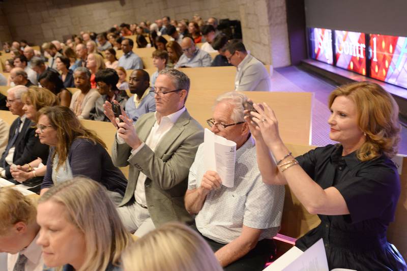 Nazareth family members including (left & right) Dan and Gina Pekofske of Downers Grove as well as Doug Julius of Iowa photograph their graduates during the mass and graduation held on Sunday, May 18, 2025 at Christ Church of Oak Brook.