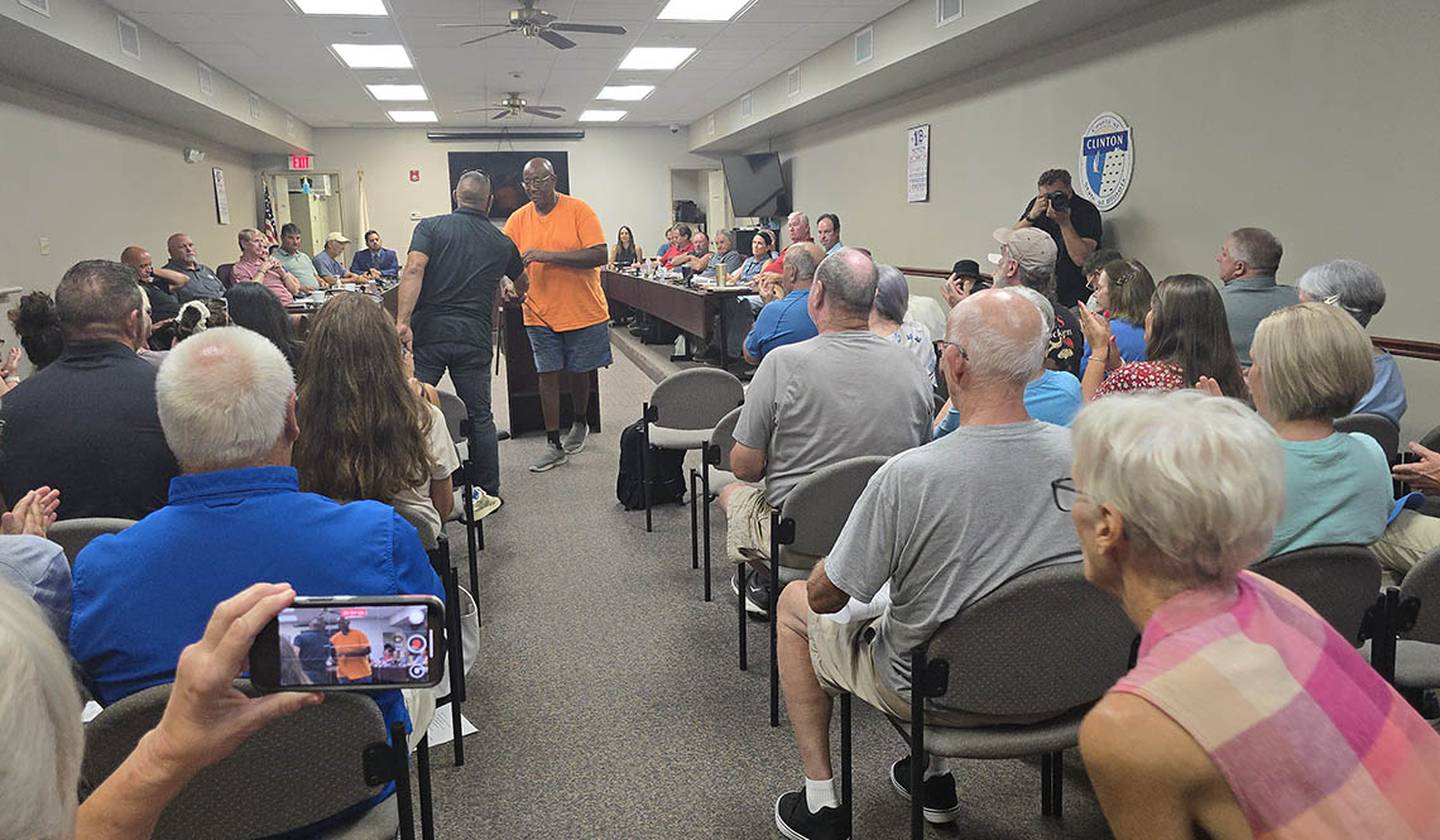 Nearly 70 people packed a Clinton County Board meeting Monday night, Aug. 18, 2025, to oppose a Proud Boys ad on a billboard near Central Community High School.