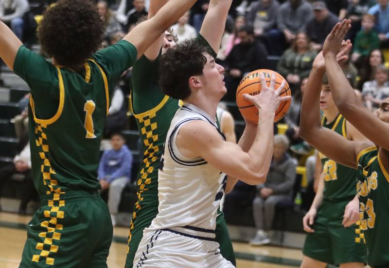 Cary-Grove’s Adam Bauer navigates heavy Crystal Lake South traffic in boys IHSA Class 3A Regional Championship basketball on Friday, Feb. 27, 2026, at Crystal Lake South High School in Crystal Lake.