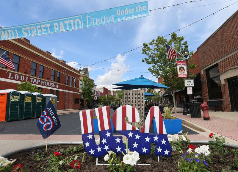 A view of a USA America 250 flower bed during Mill Street dining on Friday, May 8, 2026 downtown Utica. The road will be closed to traffic until late October.