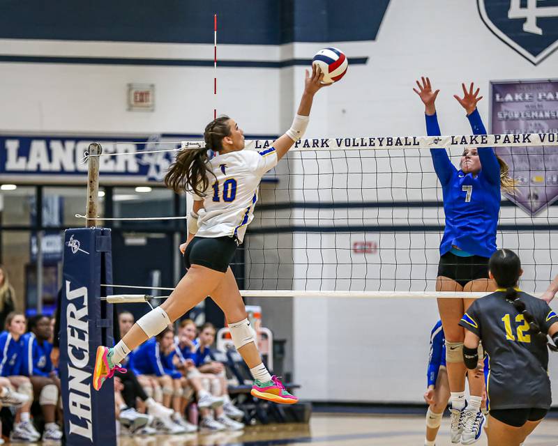 Wheaton North's Haley Hanavan (10) tips the ball during Class 4A Lake Park Regional final volleyball match between Wheaton North at St Charles North.  Oct 31, 2024  in Roselle.