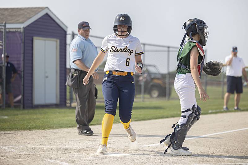 Sterling’s Olivia Melcher comes in to score the first run against Boylan Tuesday, May 23, 2023 during a class 3A regional semifinal game in Belvidere.