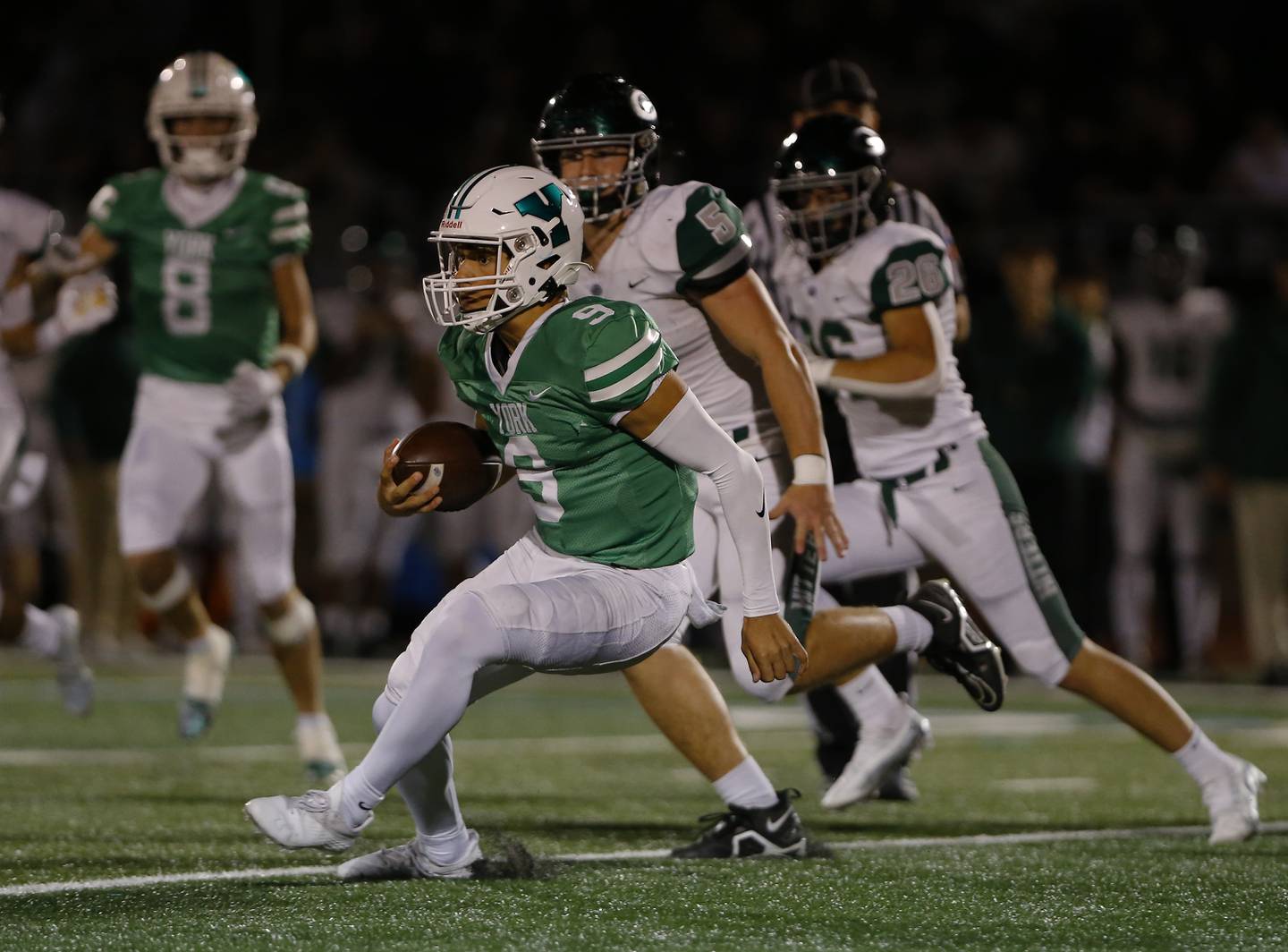 York's Matt Vezza (9) runs the ball during the boys varsity football game between York and Glenbard West on Friday, Sept. 30, 2022 in Elmhurst, IL.