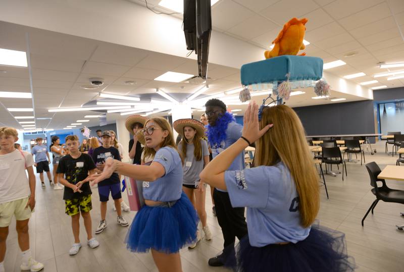 Downers Grove South freshman students get a tour of the school with help from students including Junior, Maya Kolakowski during orientation and Mad Dash held Saturday Aug 19, 2023.