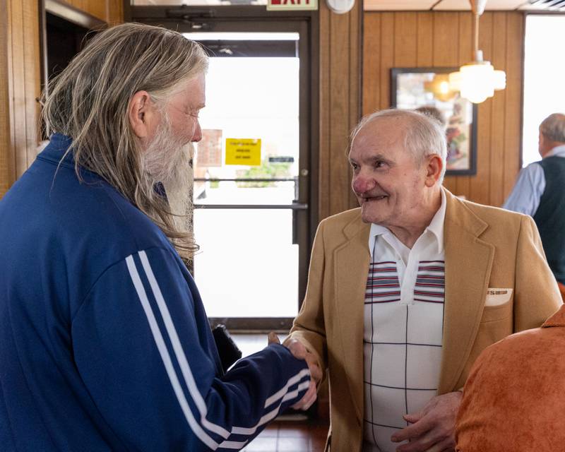 Sam Leone shakes hand of frequent customer at Sam’s retirement celebration on Saturday, October 25, 2025 at the Rootbeer Stand in Oglesby.