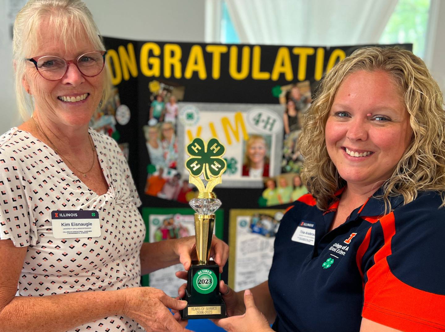 4-H staff and volunteers surprised program coordinator Kim Eisnaugle, left, with a special trophy to commemorate her last 4-H show season and her upcoming retirement from Illinois Extension.