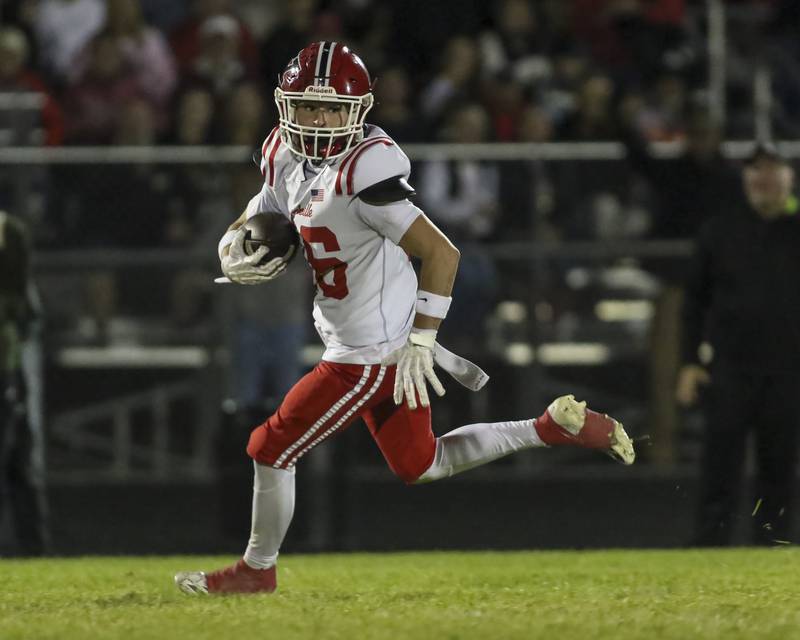 Yorkville's Joel Castillo (16) runs after a catch during football game between Yorkville at Oswego East Friday, Oct 10, 2025 in Oswego.