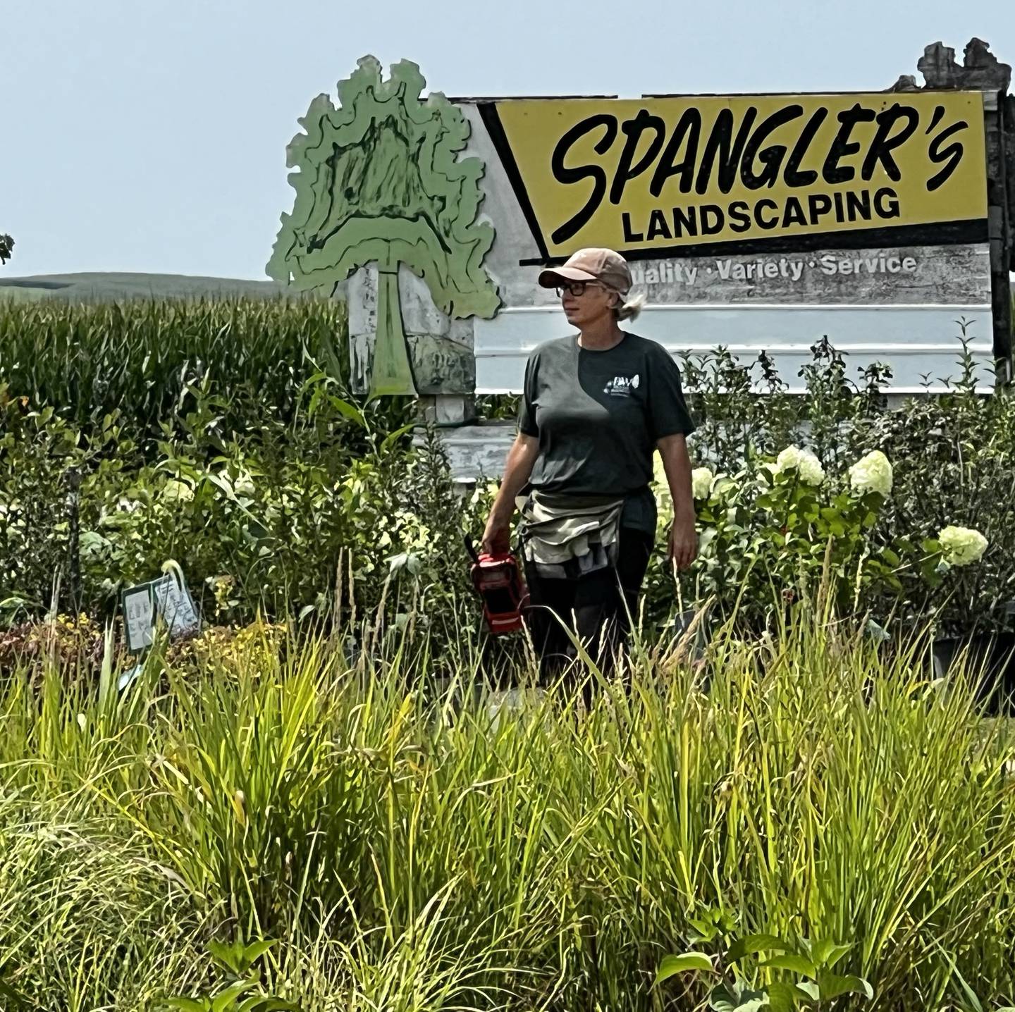 Kendra Kirk looks over some of the stock at Spangler's Landscaping on Friday, July 26, 2024.