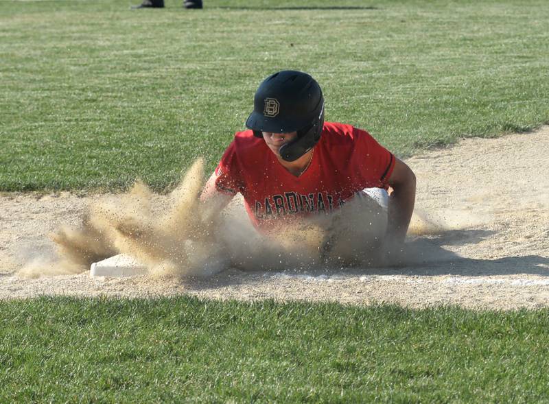 Forreston's Kendall Erdmann dives back salfely to first against Lena-Winslow at the 1A Forreston Sectional on Wednesday, May 22, 2024.