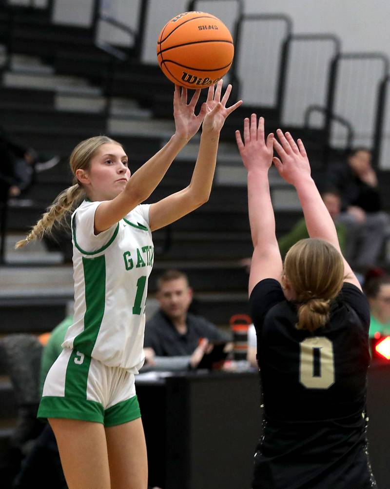 Crystal Lake South's Makena Cleary shoots the ball over Grayslake North's Jane Pritchard during a Northern Illinois Holiday Classic semifinal girl basketball game on Tuesday, Dec. 16, 2025, at McHenry High School.