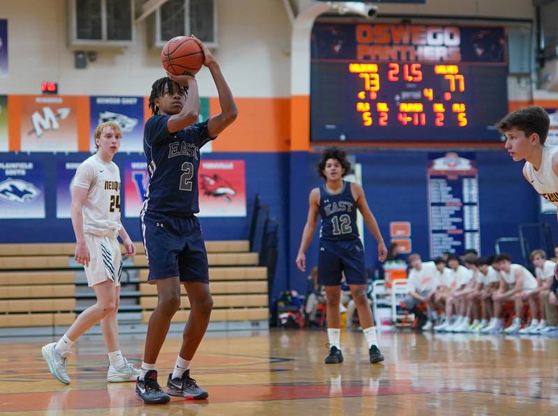 Oswego East's Mason Lockett IV (2) shoots a free-throw late in the 4th quarter of play during a hoops for healing basketball tournament game against Neuqua Valley at Oswego High School on Friday, Nov 24, 2023.