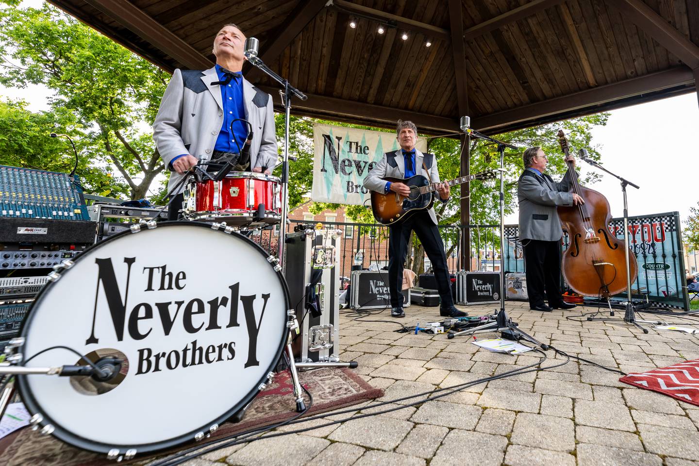 The Neverly Brothers, Kegham Giragosian (drums), Kevin Giragosian (guitar), and Rocca Phipps (bass), perform during Cruisin' Into Lockport on June 3, 2024.