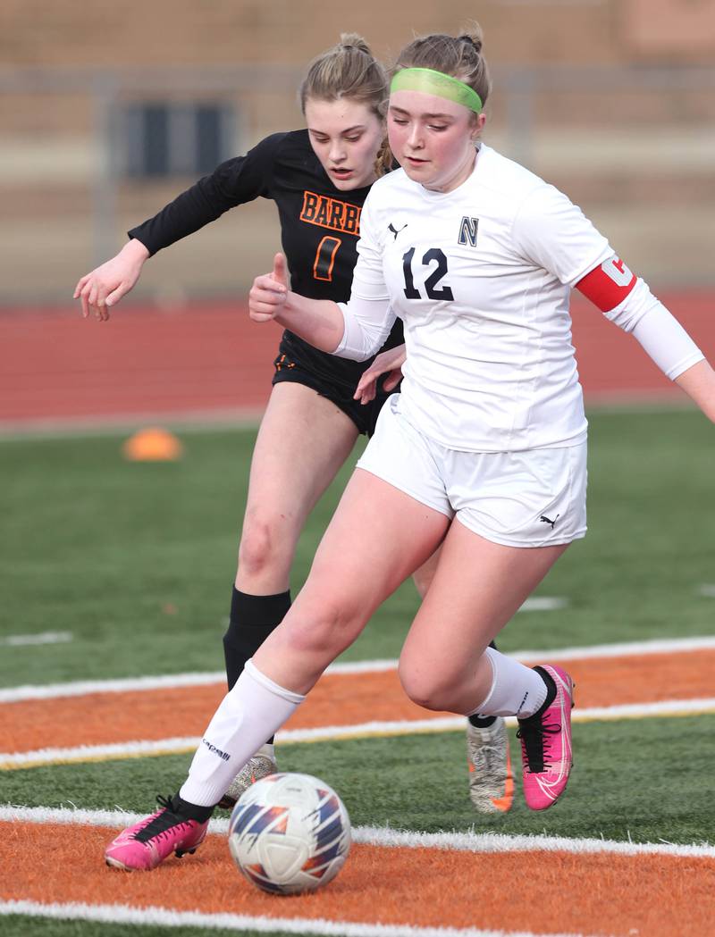 DeKalb’s Hannah Safford tries to run down Belvidere North’s Scarlett Reece during their game Wednesday, March 15, 2023, at DeKalb High School.