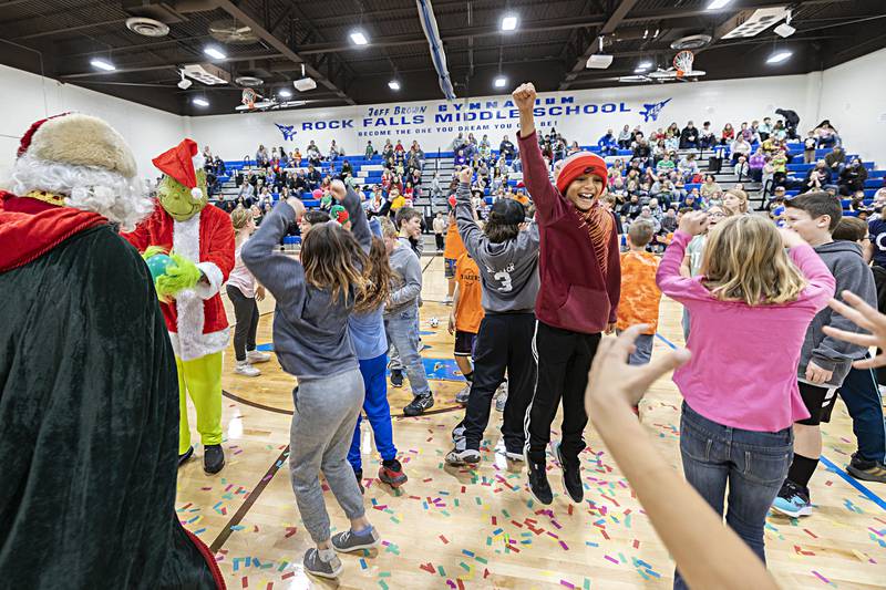 Santa himself played referee to the contest. Here he declares the kids the winners of a dodgeball game against the Grinch Saturday, Nov. 18, 2023.