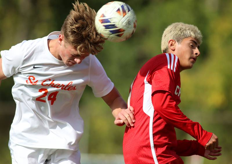 Dundee-Crown’s Hugo Arista, right, battles St. Charles East’s Colten Pariso for the ball in IHSA Class 3A Regional Championship soccer at Dundee-Crown High School in Carpentersville on Saturday, October 25, 2025.