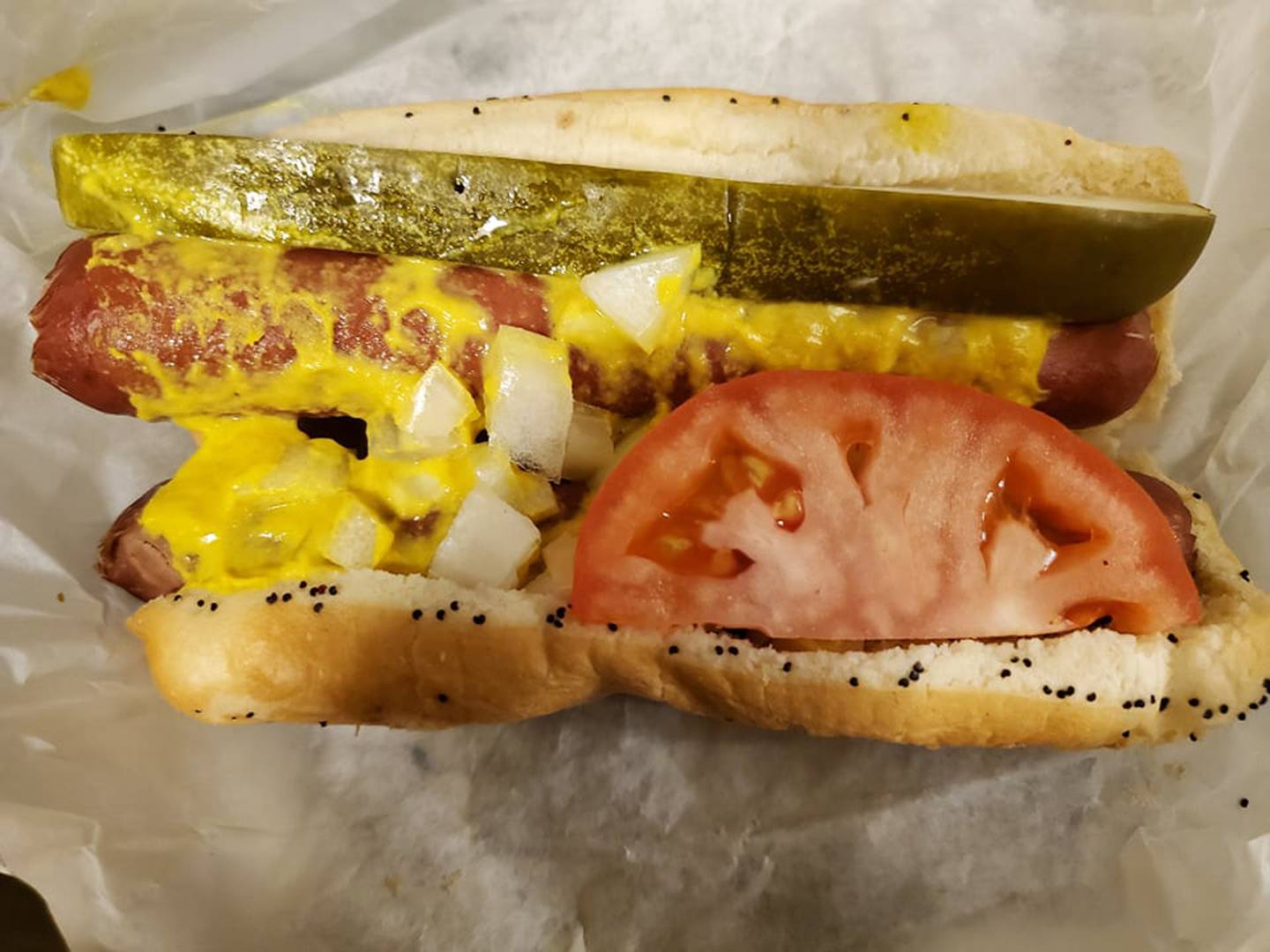 The Chicago-style double dog at 
Johnny’s Beef & Gyros in Joliet was available with these options: mustard, relish, onion, tomato, pickle, sport pepper and celery salt. We ordered ours with just mustard, onion, tomato and pickle.